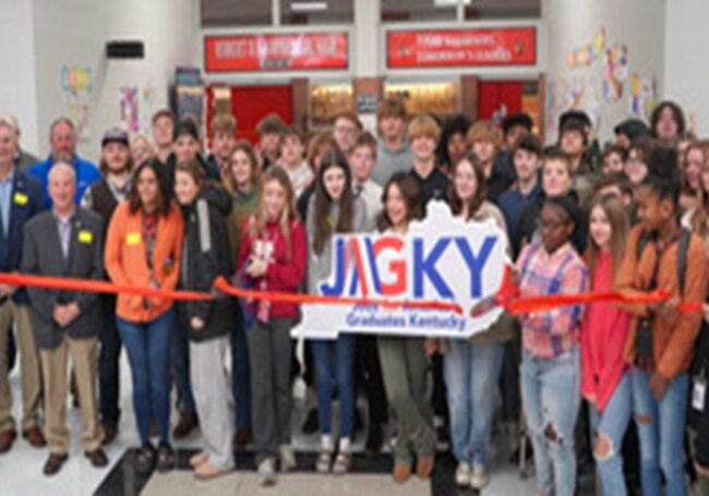 Students of Robert D. Campbell JAG program cut the ribbon celebrating membership into the Winchester-Clark County Chamber of Commerce.