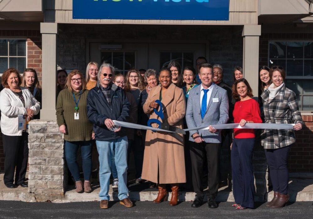 LaToya Vaughn cuts the ribbon celebrating New Vista membership into the Winchester-Clark County Chamber of Commerce.