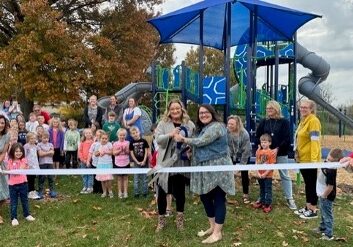 Diana Jackson, Principal, and Lindsey Campbell, Assistant Principal, of Shearer Elementary School cut the ribbon celebrating not only membership into the Winchester-Clark County Chamber of Commerce but a NEW playground!
