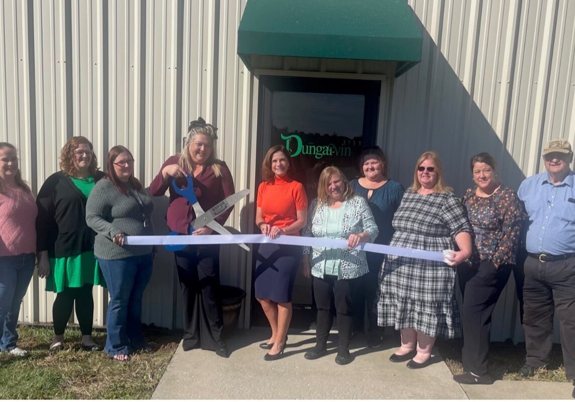 Megan Rhinehimer cuts the ribbon celebrating Dungarvin’s membership into the Winchester-Clark County Chamber of Commerce.